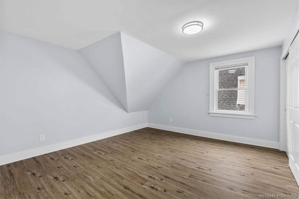 55 Admiral Street, Unit 2 New Haven, CT 06511 - Photo 24 of 35 wooden floor in an empty room with a window