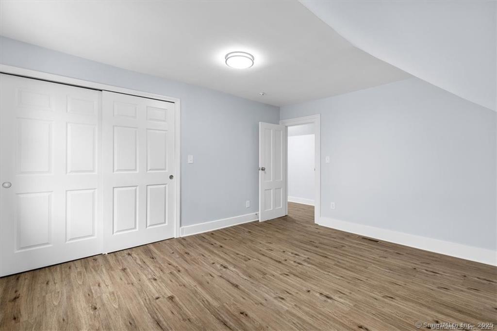 55 Admiral Street, Unit 2 New Haven, CT 06511 - Photo 25 of 35 a view of an empty room with wooden floor