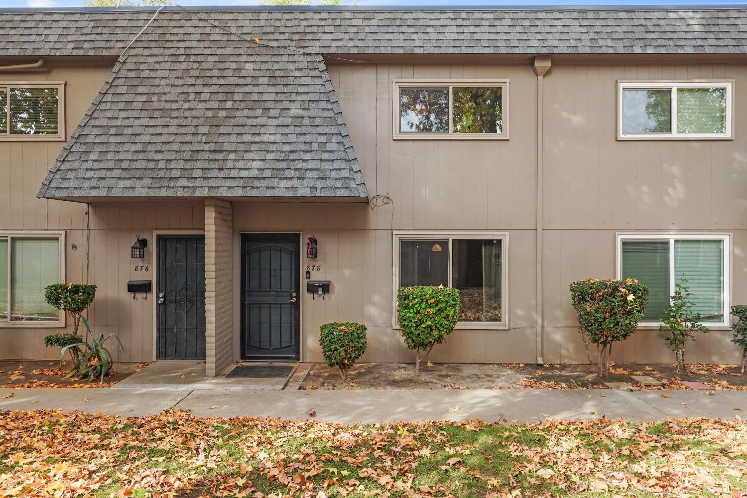 a front view of a house with garden