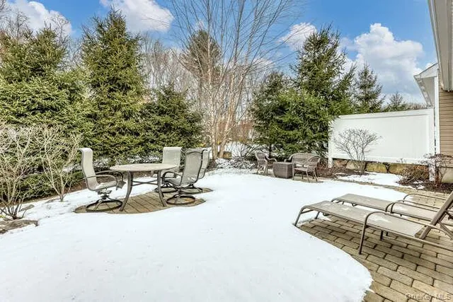 a view of a swimming pool with a lounge chair