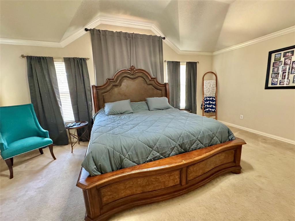 2016 Postwood Court Corinth, TX 76210 - Photo 16 of 39 a bedroom with a bed chair and window