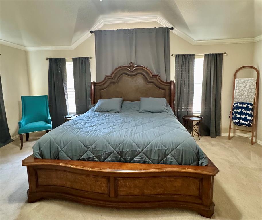 2016 Postwood Court Corinth, TX 76210 - Photo 17 of 39 a bedroom with a bed and a chair