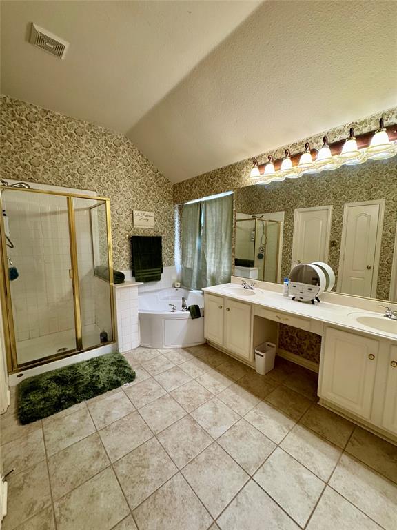 2016 Postwood Court Corinth, TX 76210 - Photo 19 of 39 a spacious bathroom with a double vanity sink and a mirror