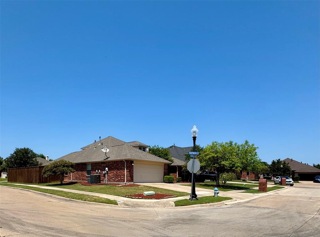 2016 Postwood Court Corinth, TX 76210 - Photo 2 of 39 a view of a street with houses