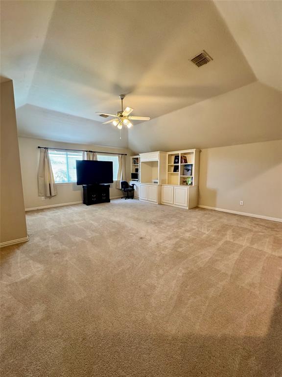 2016 Postwood Court Corinth, TX 76210 - Photo 22 of 39 an empty room with windows and fireplace