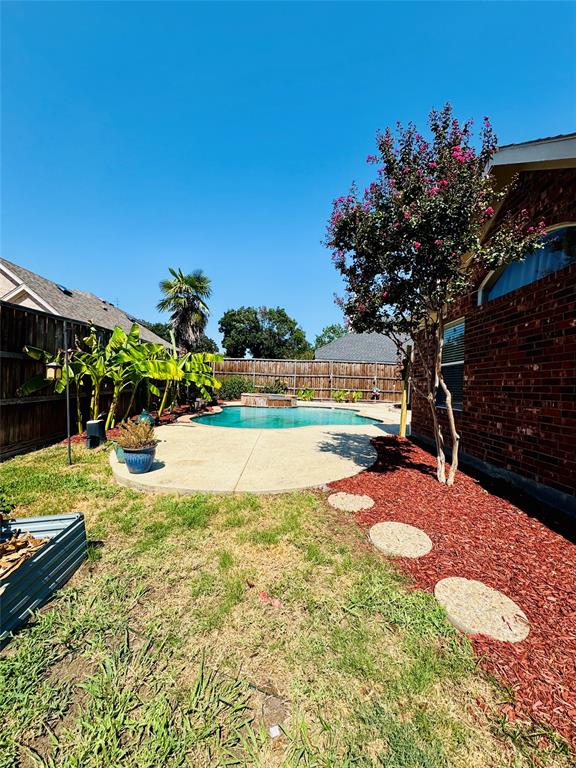 2016 Postwood Court Corinth, TX 76210 - Photo 26 of 39 a view of swimming pool with lawn chairs and potted plants