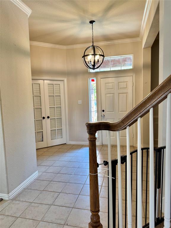 2016 Postwood Court Corinth, TX 76210 - Photo 28 of 39 a view of entryway with stairs and wooden floor