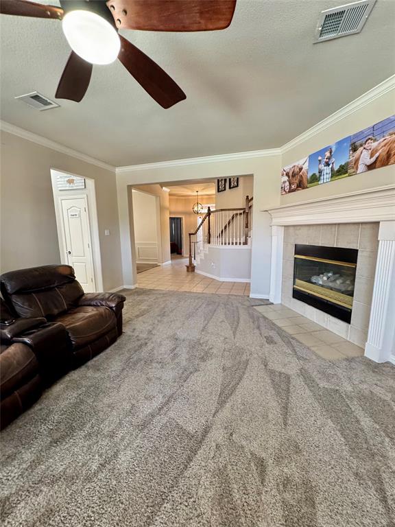 2016 Postwood Court Corinth, TX 76210 - Photo 33 of 39 a living room with furniture and a fireplace