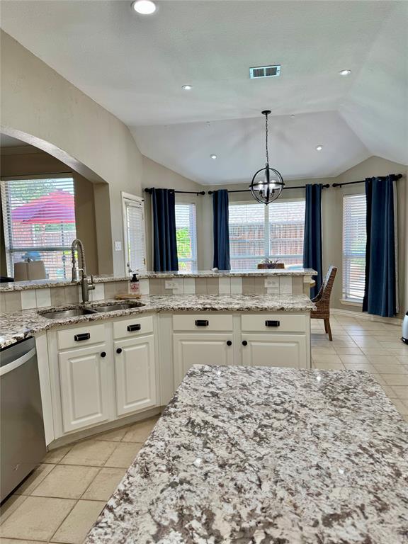 2016 Postwood Court Corinth, TX 76210 - Photo 35 of 39 a open kitchen with granite countertop a sink and white cabinets