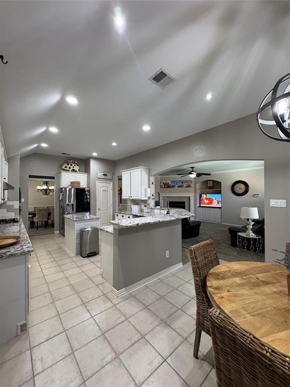 2016 Postwood Court Corinth, TX 76210 - Photo 36 of 39 a kitchen with stainless steel appliances kitchen island granite countertop a sink counter top space cabinets and furniture