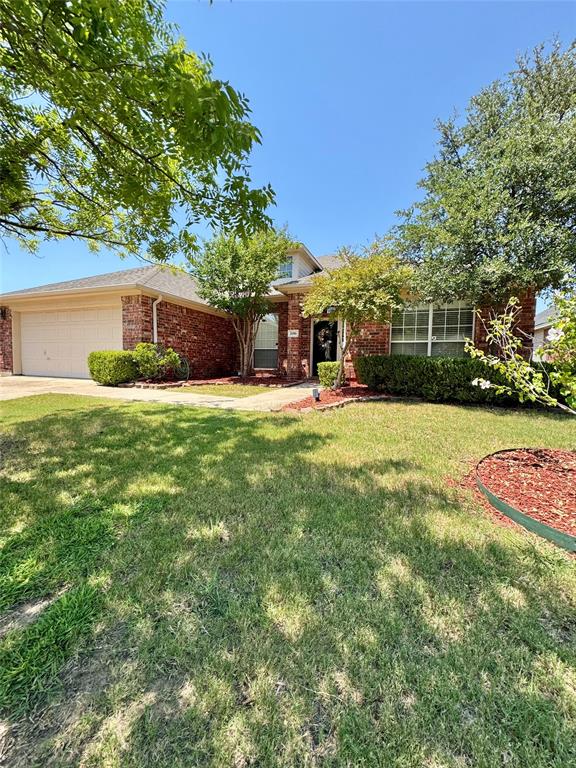 2016 Postwood Court Corinth, TX 76210 - Photo 37 of 39 a view of a house with a yard and sitting area