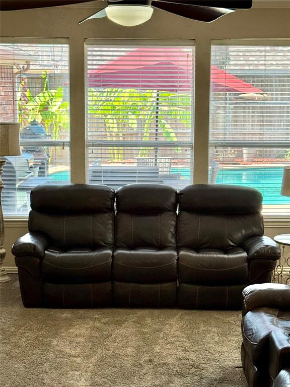 2016 Postwood Court Corinth, TX 76210 - Photo 9 of 39 a living room with furniture and a large window