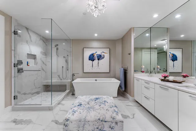 a large bathroom with a double vanity sink mirror and bathtub