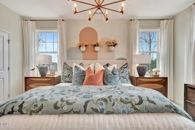 a bathroom with a granite countertop toilet sink and mirror