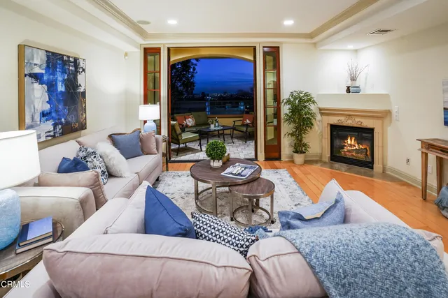 a view of a balcony dining table and chairs