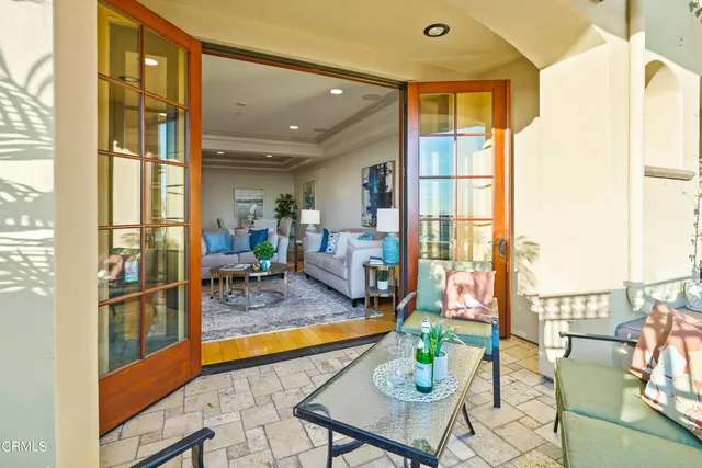 a terrace with outdoor seating and trees