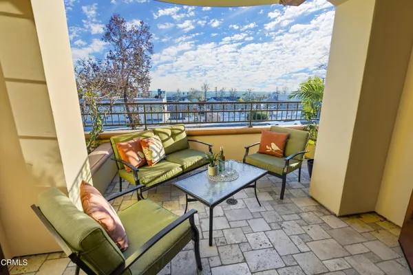 a outdoor living space with furniture and a potted plant
