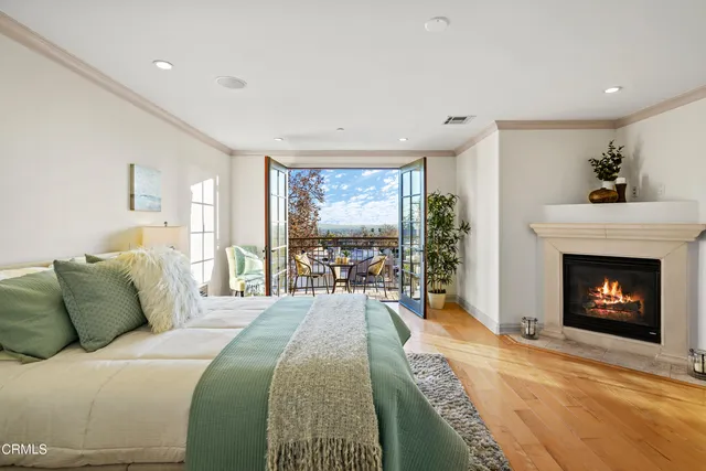 a bed room with a bed and a fireplace