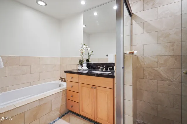 a bathroom with a glass shower door