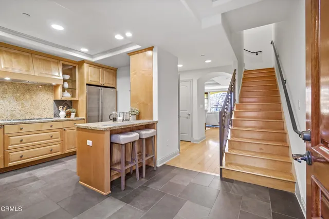 a bathroom with a sink a vanity and a large mirror
