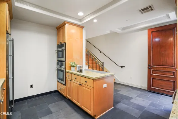 a view of a hallway with washer and dryer