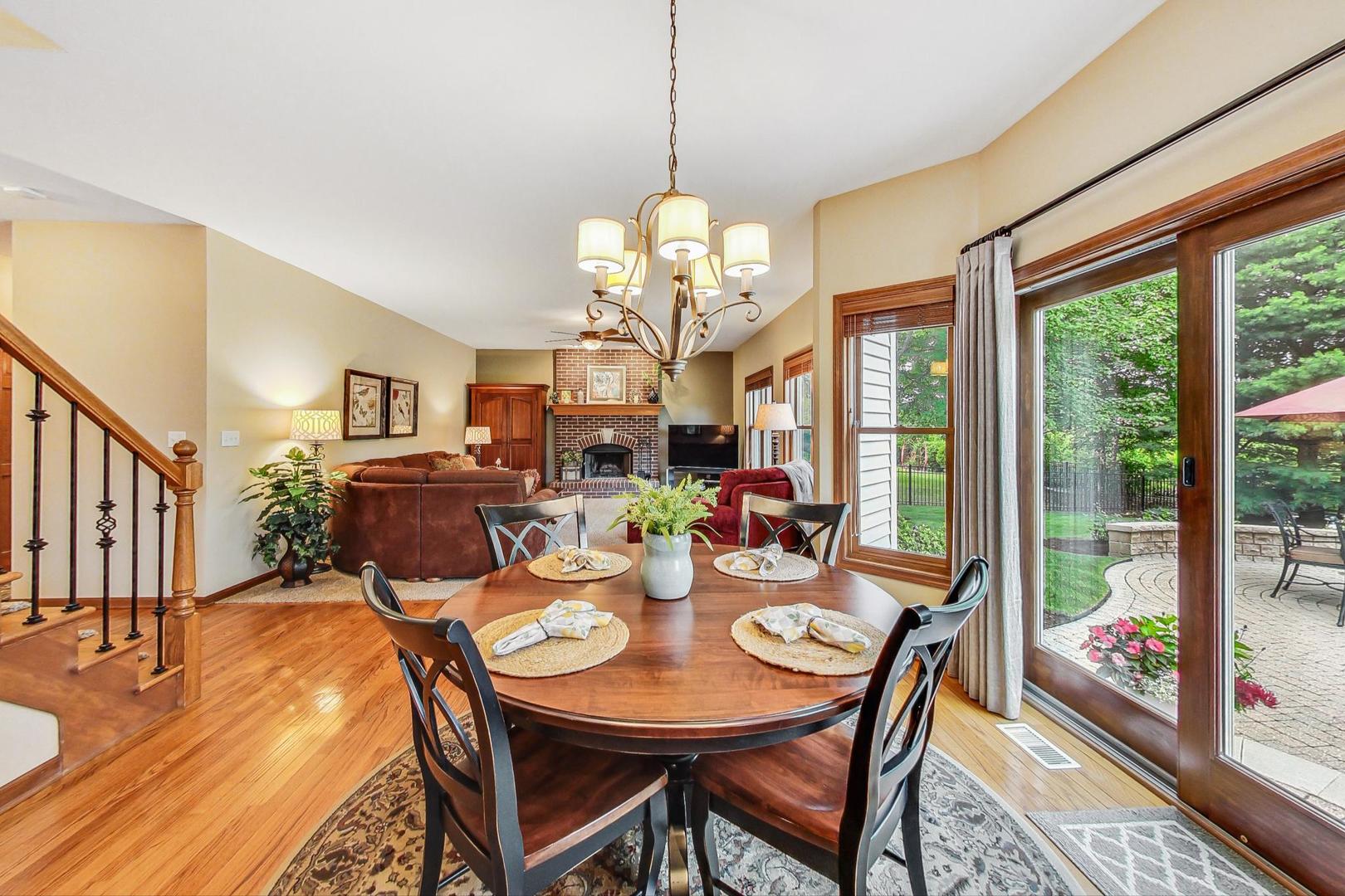 S548 Grengs Lane Geneva, IL 60134 - Photo 15 of 49 a view of a dining room with furniture wooden floor and chandelier
