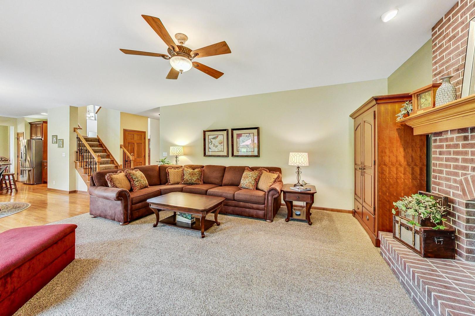 S548 Grengs Lane Geneva, IL 60134 - Photo 16 of 49 a living room with furniture and flowers