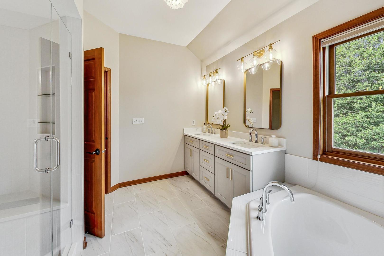 S548 Grengs Lane Geneva, IL 60134 - Photo 22 of 49 a bathroom with a double vanity sink mirror and shower