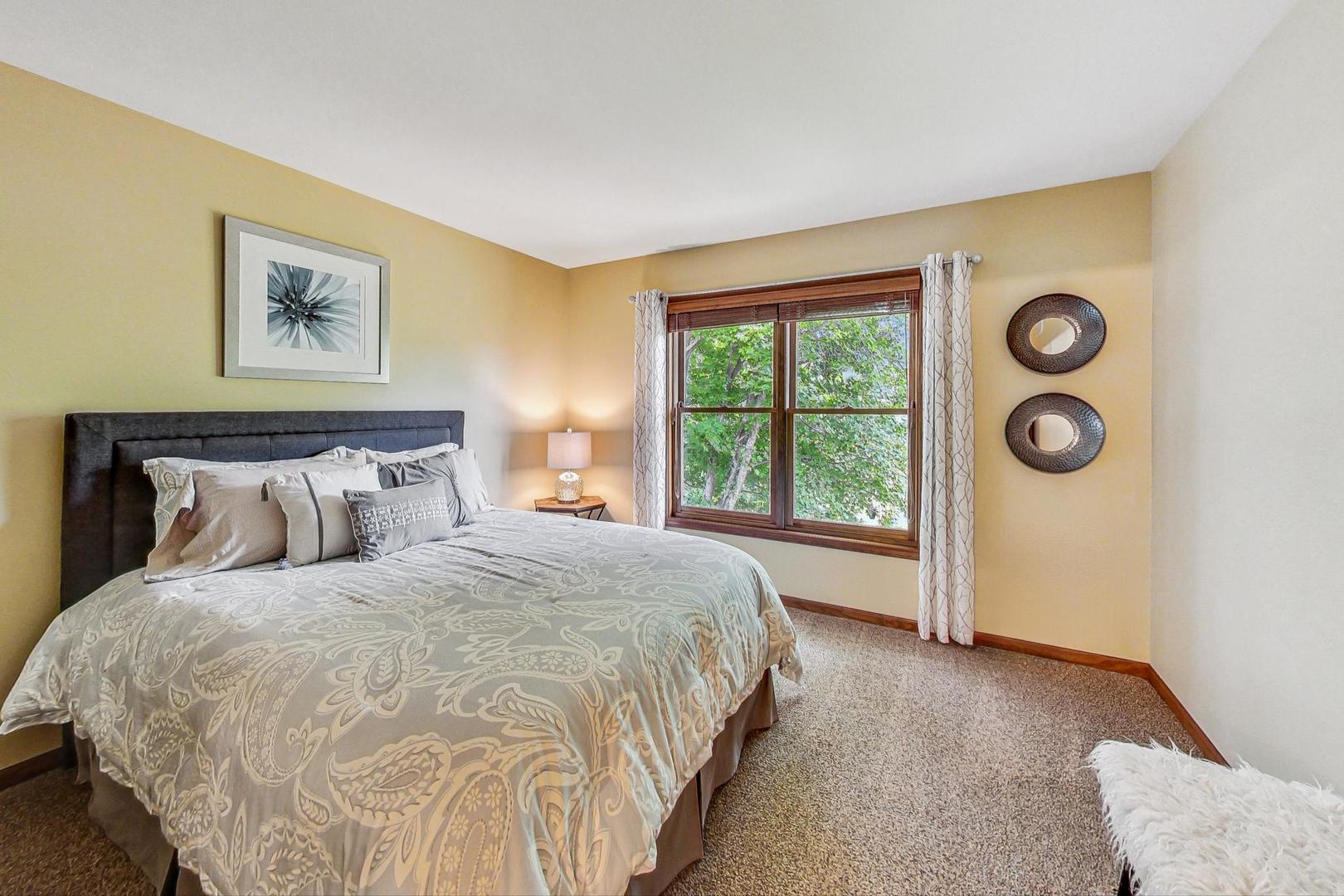 S548 Grengs Lane Geneva, IL 60134 - Photo 28 of 49 a spacious bedroom with a bed and a window