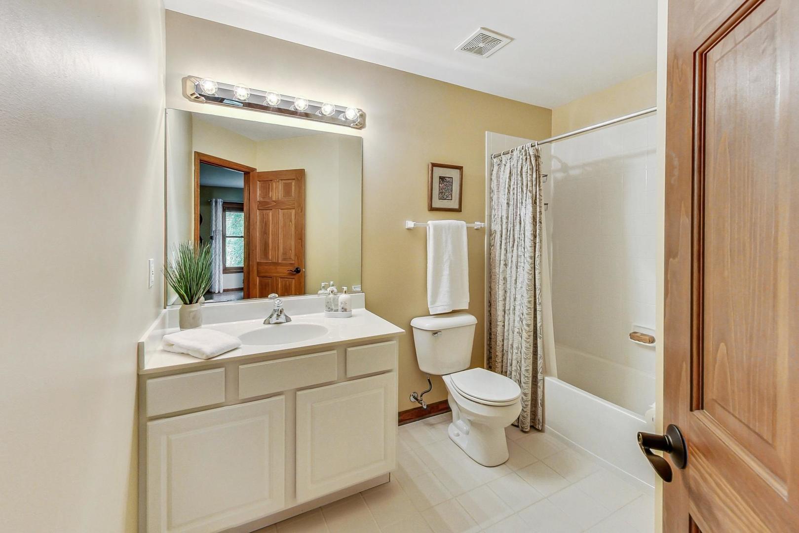 S548 Grengs Lane Geneva, IL 60134 - Photo 30 of 49 a bathroom with a sink toilet and shower