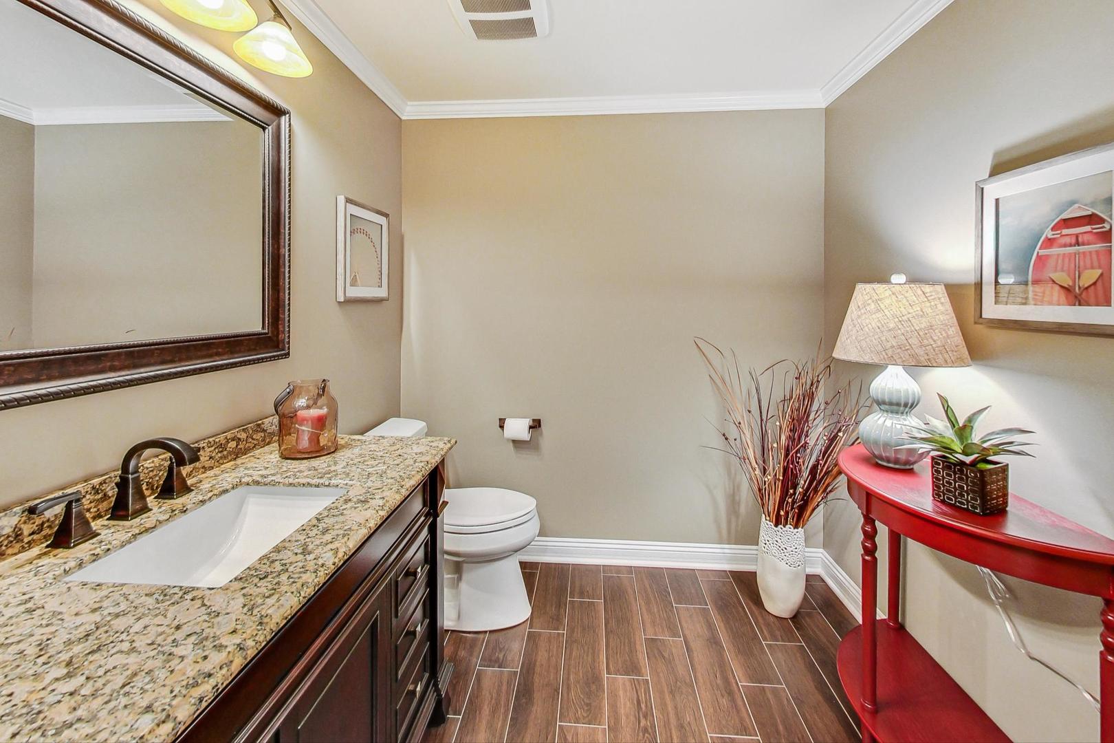 S548 Grengs Lane Geneva, IL 60134 - Photo 39 of 49 a bathroom with a granite countertop sink and a mirror