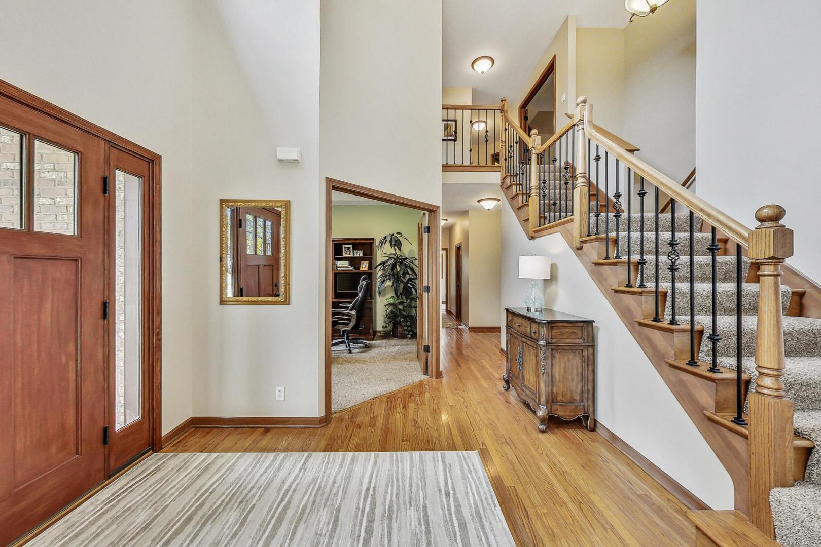 S548 Grengs Lane Geneva, IL 60134 - Photo 5 of 49 a view of entryway and hall with wooden floor