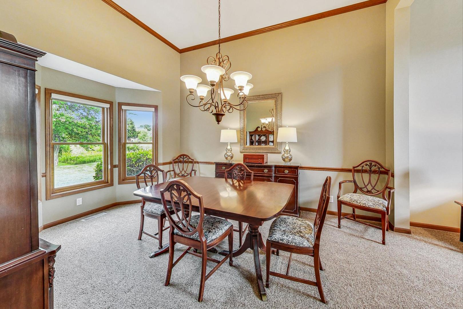 S548 Grengs Lane Geneva, IL 60134 - Photo 10 of 49 a view of a dining room with furniture and a chandelier