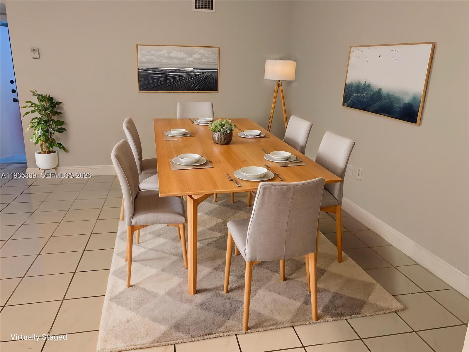 12447 Northwest 7th Street Miami, FL 33172 - Photo 12 of 29 a view of a dining room with furniture