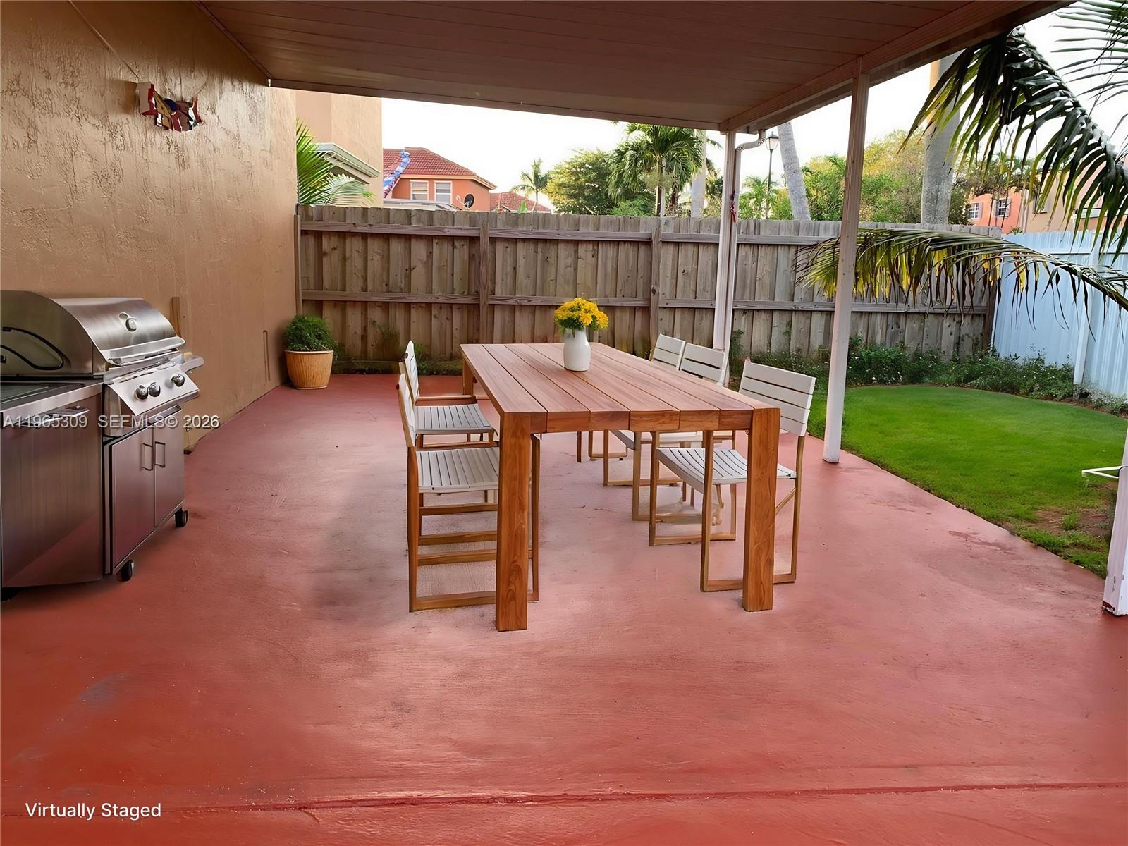 12447 Northwest 7th Street Miami, FL 33172 - Photo 27 of 29 a view of a chairs and tables in the patio