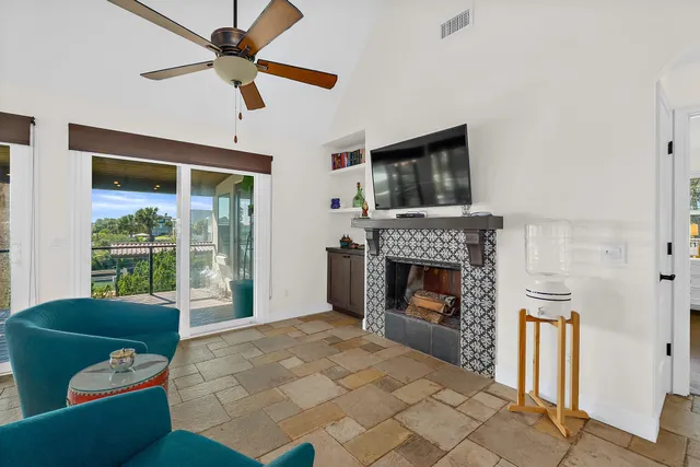 a living room with furniture and a fireplace