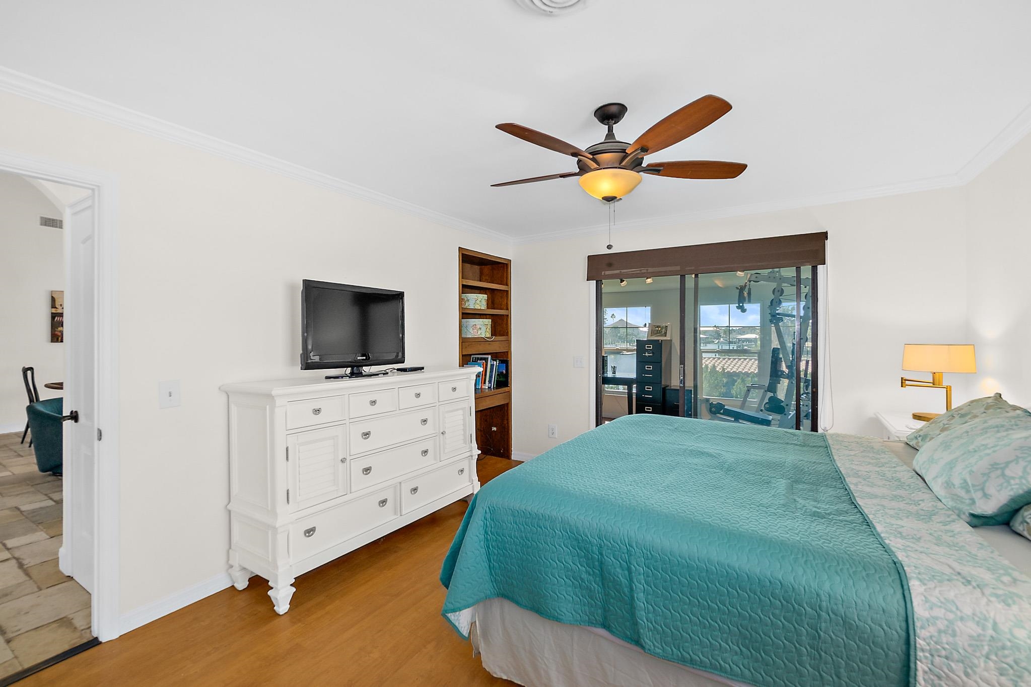 8851 South A1a Street St. Augustine, FL 32080 - Photo 24 of 50 a bedroom with a large bed and a flat screen tv