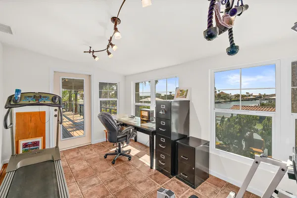 a view of a livingroom with furniture and a window
