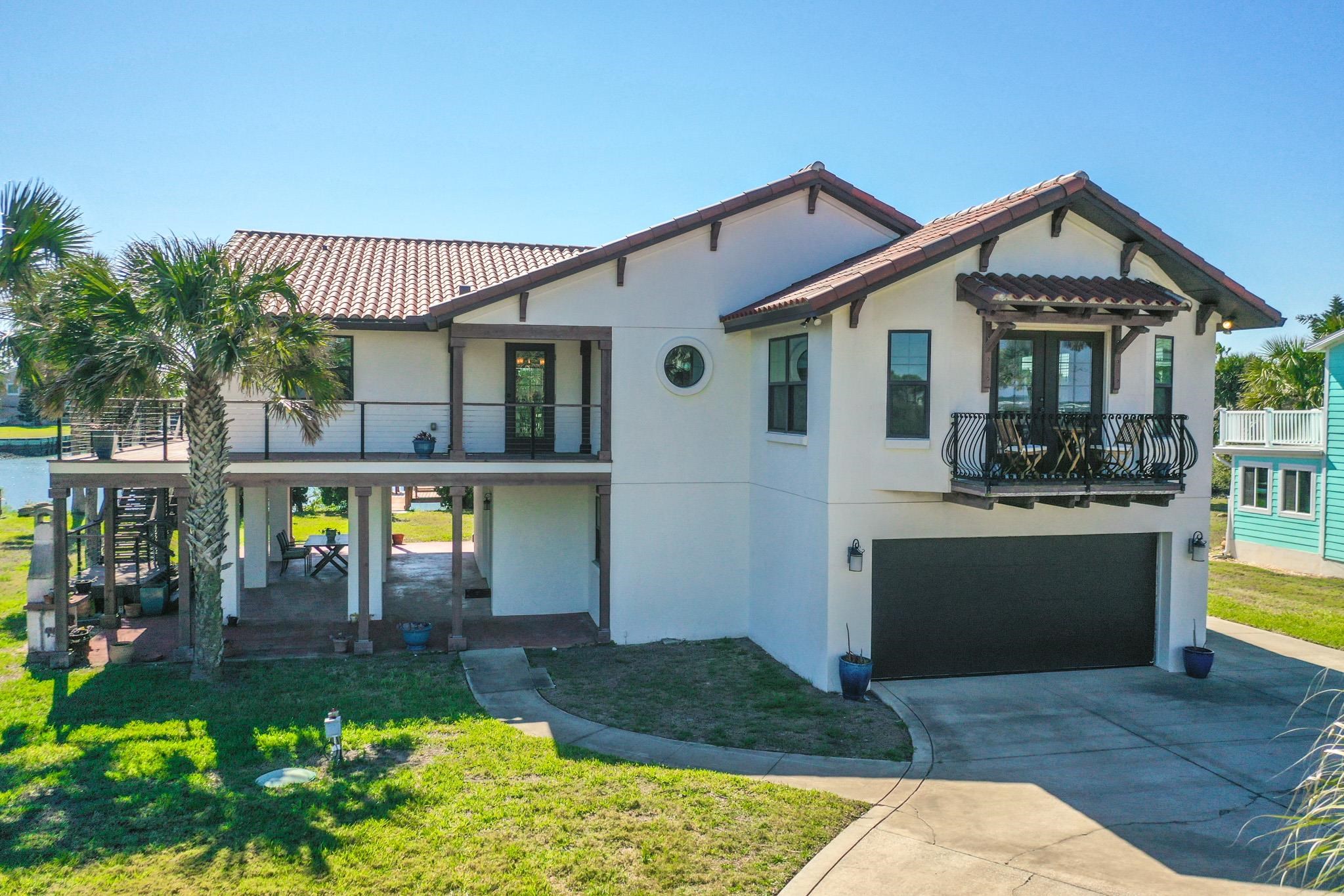 8851 South A1a Street St. Augustine, FL 32080 - Photo 3 of 50 a front view of a house with yard