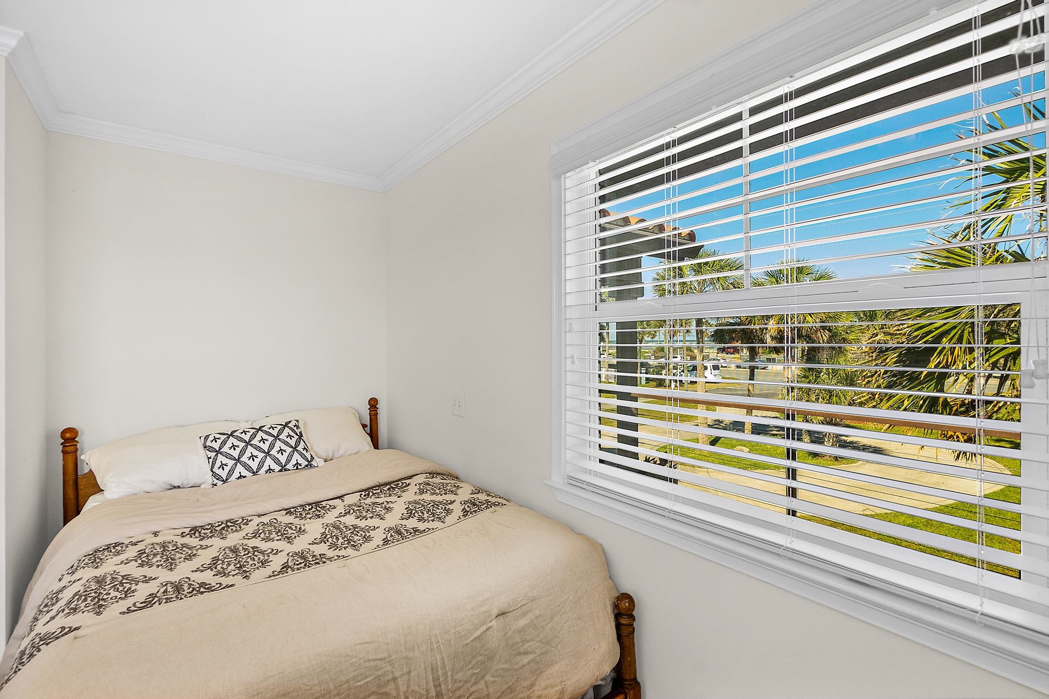 8851 South A1a Street St. Augustine, FL 32080 - Photo 32 of 50 a bedroom with a bed and a window