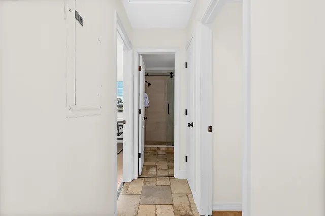 a view of a hallway with a shower