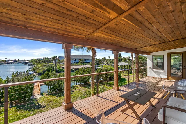 a view of a patio with wooden floor