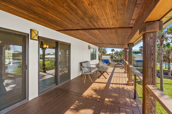 a patio with yard glass top table and chairs