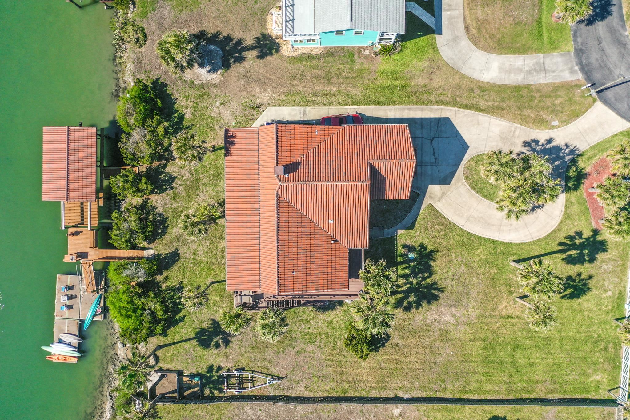8851 South A1a Street St. Augustine, FL 32080 - Photo 50 of 50 an aerial view of a house with a yard and plants
