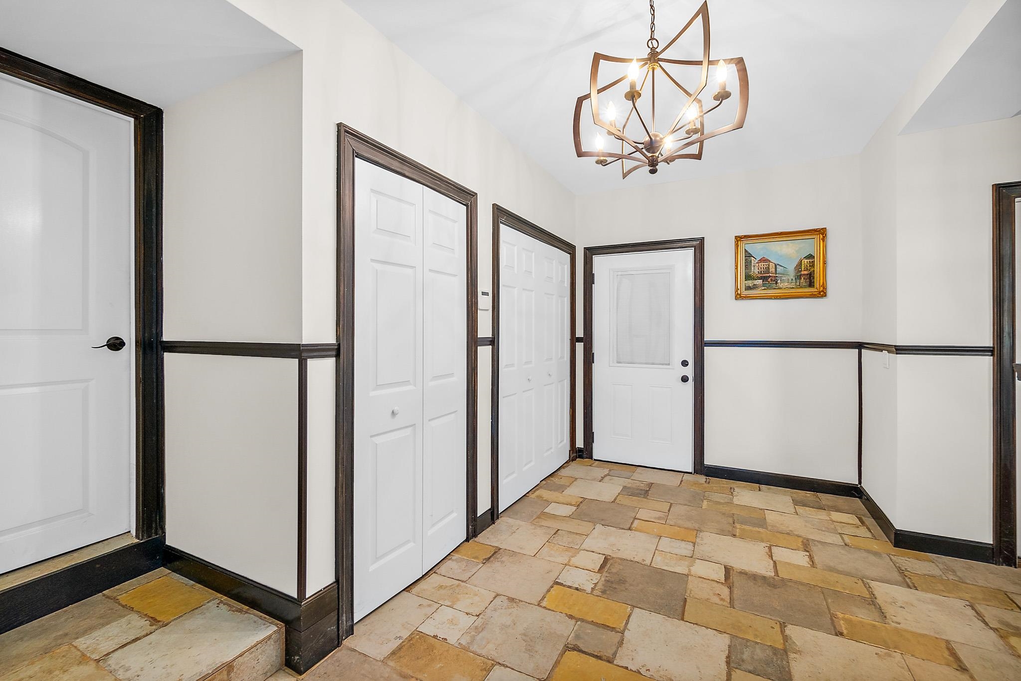 8851 South A1a Street St. Augustine, FL 32080 - Photo 7 of 50 a view of a hallway with front door