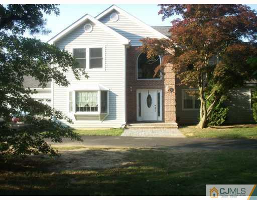 10 Middlesex Road Matawan, NJ 07747 - Photo 1 of 8 a front view of a house with a yard
