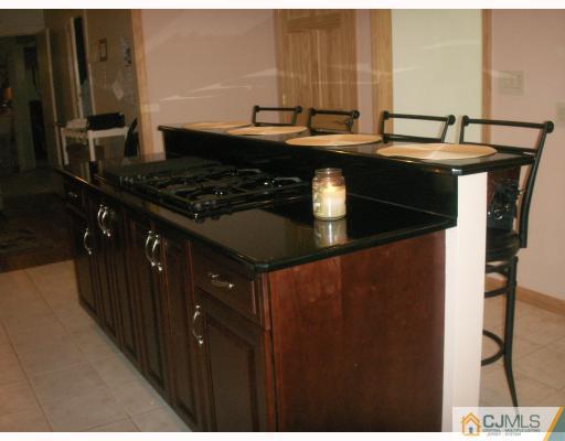 10 Middlesex Road Matawan, NJ 07747 - Photo 3 of 8 a kitchen with a sink and cabinets
