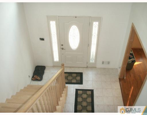 10 Middlesex Road Matawan, NJ 07747 - Photo 5 of 8 a bathroom with a toilet and a mirror