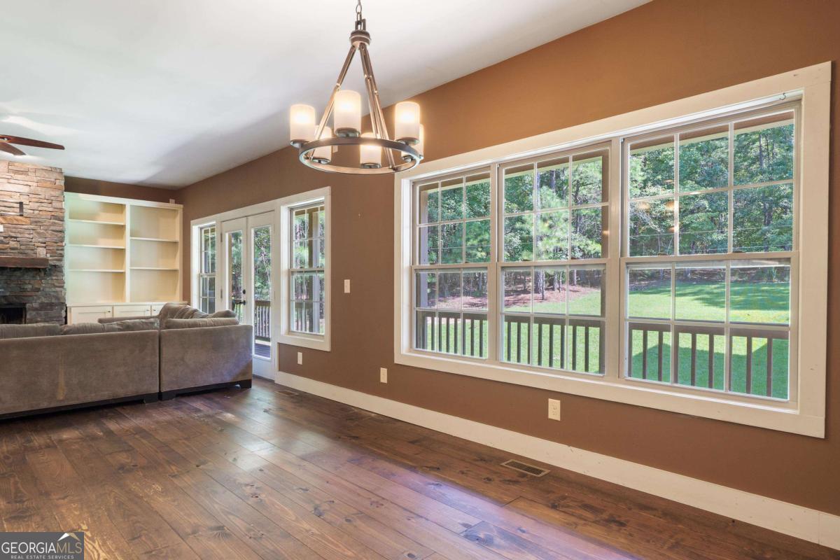 1991 Armour Bridge Road Greensboro, GA 30642 - Photo 17 of 41 a living room with furniture and a chandelier