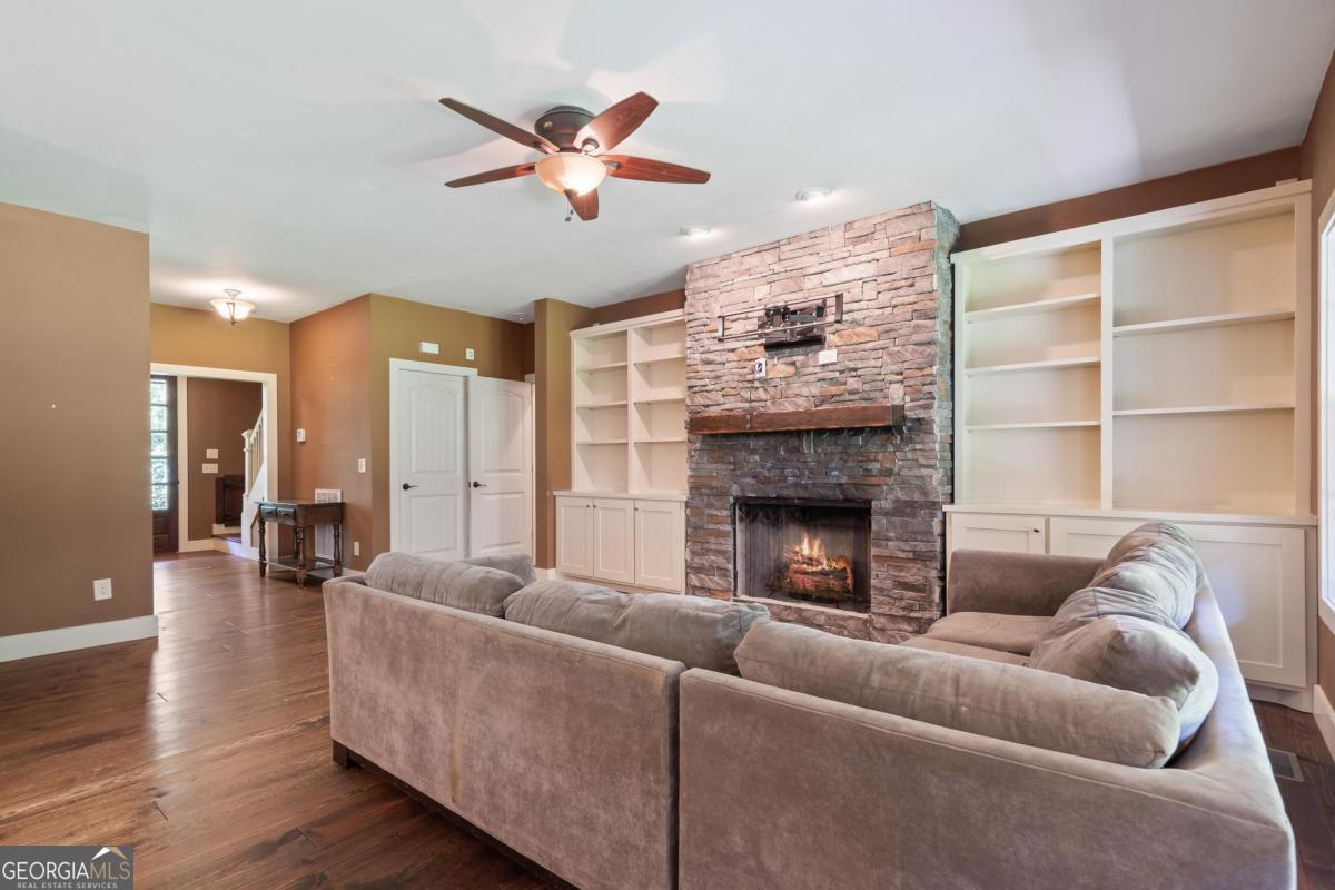 1991 Armour Bridge Road Greensboro, GA 30642 - Photo 20 of 41 a living room with furniture and a fireplace